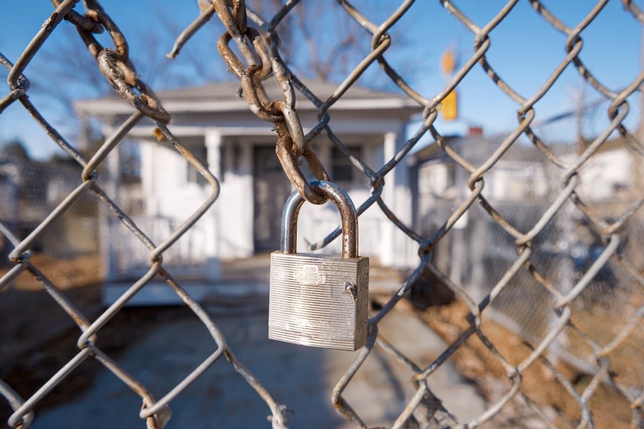 Secured vacant property in Maryland with locks and fencing